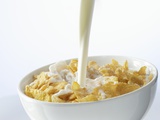 Pouring Milk over Cornflakes Photographic Print by Marc O. Finley