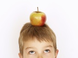 Small Boy with Apple on His Head Photographic Print by Marc O. Finley