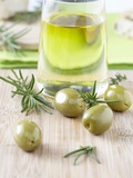 Olive Oil, Green Olives and Rosemary on Chopping Board Photographic Print by Jo Kirchherr