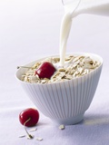 Pouring Milk onto Oat Flakes Photographic Print