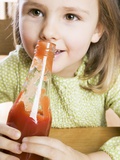 Girl Holding a Bottle of Ketchup Photographic Print