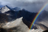 A Rainbow Arcs Above a Mountain Pass in the Brooks Range Photographic Print by Michael Christopher Brown