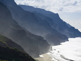 The Fluted Ridges of the Na Pali Coast Above the Crashing Surf on the North Shore of Kauai, Hawaii. Photographic Print by Sergio Ballivian