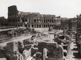 Roman Colosseum and Surrounding Ruins Photographic Print by Bettmann 