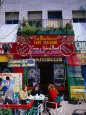 People Sitting Outside Cafe in La Boca, Buenos Aires, Argentina Photographie par John Hay