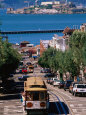 Cable Car and Other Traffic on Street with Alcatraz in Distance, San Francisco, USA