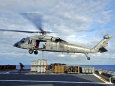 An MH-60s Seahawk Helicopter Prepares to Deliver Ammunition Lámina fotográfica por Stocktrek Images