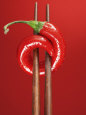 A Chili on Chopsticks Fotografisk tryk af Marc O. Finley