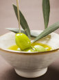 Pouring Olive Oil Over Olive Sprig with Green Olives Photographic Print
