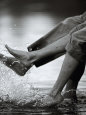 Couple Splashing Water withFeet Photographie