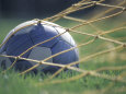 Soccer Ball in Net Lámina fotográfica por Fogstock Llc