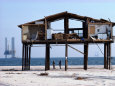 View of a Beach House Damaged by a Hurricane Photographie par Paul Chesley