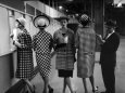 5 Models Wearing Fashionable Dress Suits at a Race Track Betting Window, at Roosevelt Raceway Lámina fotográfica por Nina Leen