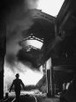 Man Walking in the Smokey Steel Mill Photographic Print by Nat Farbman