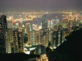 The Hong Kong Skyline is Lit up at Night with Thousands of Lights Photographic Print by Paul Chesley