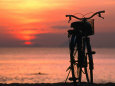 Bicycle Silhouetted Against Sunset on Nha Trang Beach, Nha Trang, Khanh Hoa, Vietnam Photographie par John Banagan