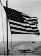Airplane on Battleship Deck with American Flag in Foreground, World War II Premium Poster