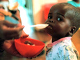 An Unidentified Baby is Fed at a Home for Hiv/Aids and Abandoned Children Fotografie-Druck