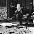 Painter Jackson Pollock Working in His Studio, Cigarette in Mouth, Dropping Paint Onto Canvas Reproduction photographique sur papier de qualité par Martha Holmes