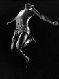 US Pentathlon Champion John Borican at the Peak of His Broad Jump Reproduction photographique sur papier de qualité par Gjon Mili