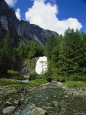 Mountain Waterfall Cascades Down Into a Babbling Brook