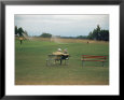 Golfers Sitting on Bench Near Practice Greens While Awaiting Tee Time on Pinehurst Golf Course