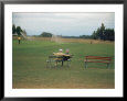 Golfers Sitting on Bench Near Practice Greens While Awaiting Tee Time on Pinehurst Golf Course