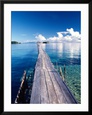 Wooden Jetty Extending off Kadidiri Island, Togian Islands, Sulawesi Framed Art Print by Jay Sturdevant