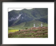 Islamic Village and Mosque Beneath Tree Covered Mountains, Qinghai, China