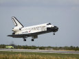 Space Shuttle Discovery Approaches Landing on the Runway at the Kennedy Space Center